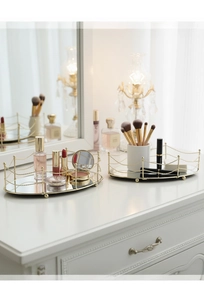 Detail of luxury gold geometric mirrored vanity tray set for perfumes and cosmetics