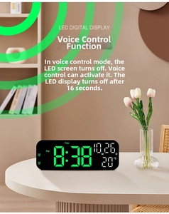 Modern LED digital clock with green display showing time, date, and temperature via voice control