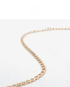 Macro detail of high-quality light gold metal chain strap with polished flat links