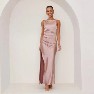 Detail of satin dress showing the side slit design and smooth fabric texture in pink