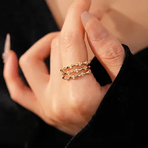 Luxury gold bamboo zircon three-layer open ring featuring sparkling white stones