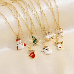 Detail of colorful enamel Christmas necklaces with festive pendants and zircons