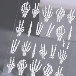 5D embossed Halloween nail stickers featuring white bone hand gestures on grey background