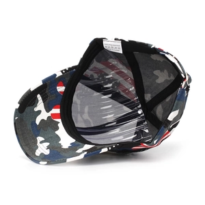 Macro view of camouflage baseball cap interior with 100% polyester fabric and washing label