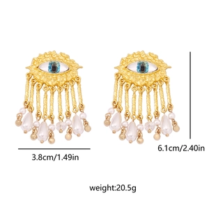 Detail view of vintage gold eye earrings with white pearl tassels and dimensions shown
