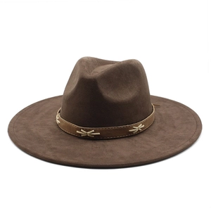Detail of vintage coffee brown fedora with braided leather band on white background
