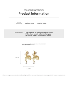 Detailed view of hollow koi fish drop earring with dimensions 7.6cm by 3.1cm