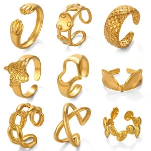 Collection of nine gold 18K plated adjustable stainless steel heart rings in grid layout