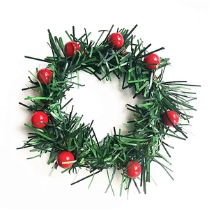 Christmas napkin ring with green pine needles and red berries for festive table decor