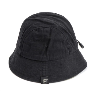 Detail of black cotton bucket hat showing adjustable drawstring and small cloth tag
