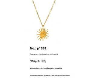 Detail of a golden sun face pendant necklace made of stainless steel with size dimensions