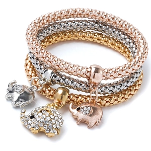 Three-piece stretch mesh bracelet set in gold, silver, and rose gold with elephant charms