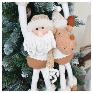 Detail of plush Santa and reindeer Christmas ornaments with knit textures and sequins