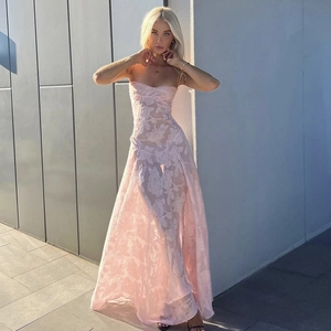 Detailed close-up of pink floral lace fabric on a sleeveless elegant evening maxi dress