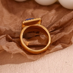 Macro shot of 18K gold plated ring featuring a rectangular blue lapis lazuli stone