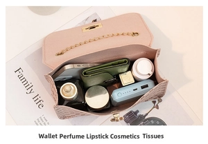 Top view of compact chain bag interior showing space for phone, wallet and cosmetics
