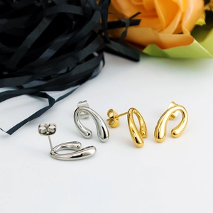 Minimalist U-shaped teardrop earring set in polished gold and silver finish