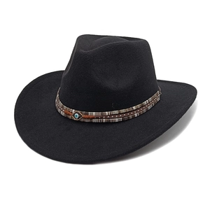 Classic black wide-brim felt hat featuring a tribal band with an evil eye ornament