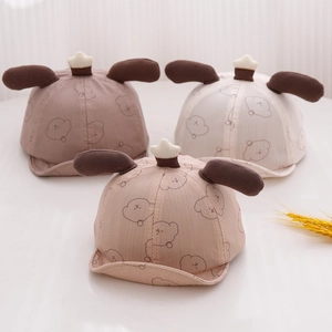 Cute baby bear ear caps in brown, khaki and cream with embroidered dog patterns