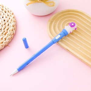 Blue astronaut spinning pen with LED light on a decorative wooden tray background