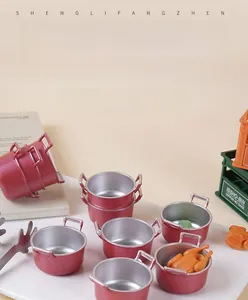 Miniature dollhouse soup pots with red exterior and silver lining among food miniatures