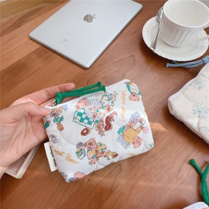 Handheld quilted floral cotton pouch with colorful bear patterns and green zipper pull