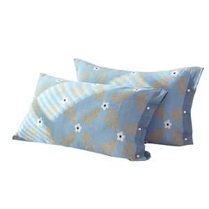 Blue cotton gauze pillowcase pair with yellow leaves, white flowers and button closure