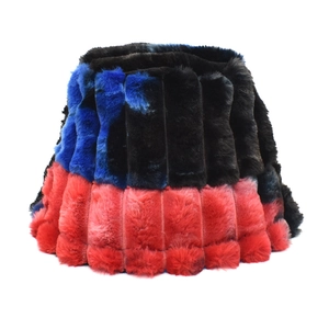 Close-up of thick plush bucket hat showing rainbow tie-dye faux fur and vertical texture