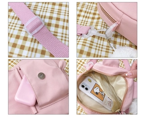 Detail showing adjustable strap, magnetic buckle and interior of pink nylon bag