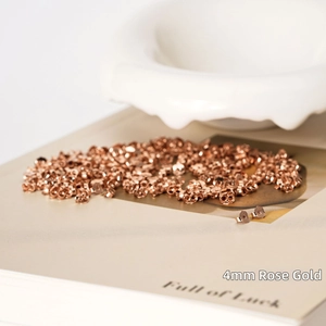 Macro detail of 4mm rose gold S925 sterling silver butterfly earring backs on art book