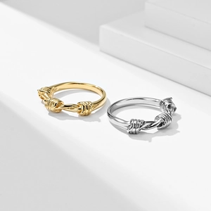 Polished titanium steel knot rings in gold and silver finish for men and women