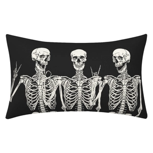 Macro shot of Halloween rectangular pillow case featuring three white skull patterns on black