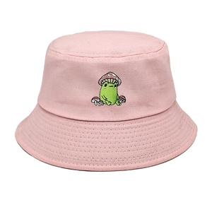 Close-up of pink cotton bucket hat with detailed frog and mushroom embroidery