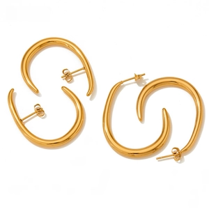 Detailed view of polished gold stainless steel crescent earrings with organic fluid lines