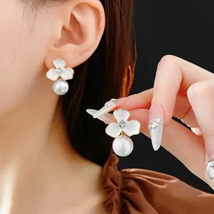 Floral stud earrings with pearls and crystals in a gold-plated French luxury style