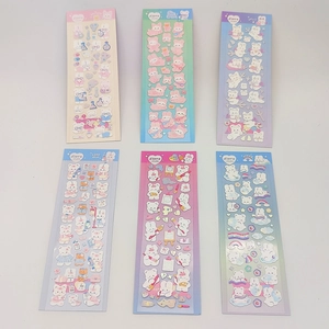 Detailed view of 6 colorful cartoon rabbit and bear stickers with holographic silver foil