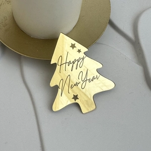 Golden Christmas tree acrylic cake topper with Happy New Year text and star details