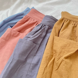Durable cotton half aprons with pockets in four solid colors for home kitchen use