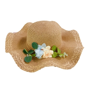 Women's summer straw sun hat with wide wavy brim and colorful floral decorations
