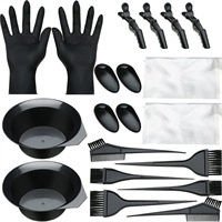 Detailed hair dye kit view showing black plastic gloves, ear covers, and mixing bowls