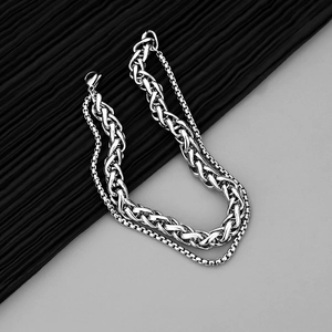 Silver double-layer stainless steel bracelet featuring woven dragon bone and box chain links