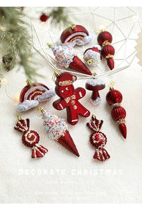 Detailed close-up of wine red Christmas ornaments including gingerbread and candy shapes