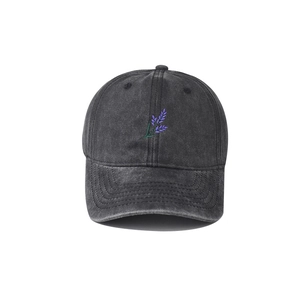 Close-up of vintage washed charcoal denim baseball cap with purple lavender embroidery