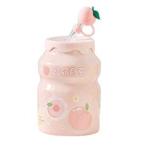 Pink peach ceramic mug in yogurt bottle shape with straw and peach-shaped cap