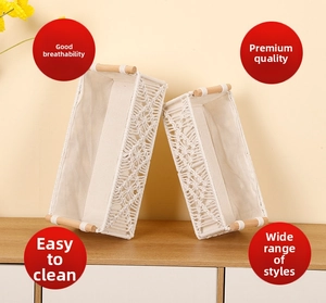 Detail of woven cotton rope baskets with hollow patterns, fabric lining and wooden handles