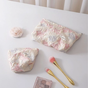 Floral jacquard cosmetic bags set with embossed pink flower pattern and woven labels