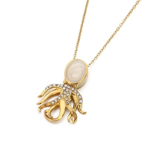 Golden octopus necklace with a white pearl head and crystal tentacles on white background