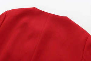 Macro shot of the red jacket back neckline showing fine textured fabric and stitching