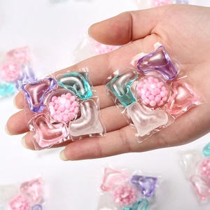 Five-in-one concentrated laundry detergent pods with multi-colored liquid and scent beads