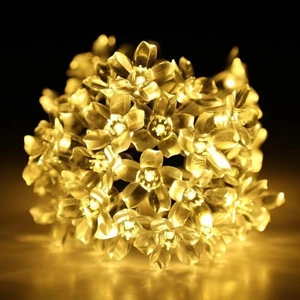 Solar powered cherry blossom LED string lights in warm yellow for outdoor garden decoration